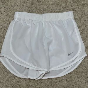 White Nike running shorts